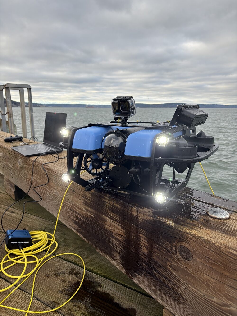 BlueROV2 staged on a dock, powered up and ready to dive